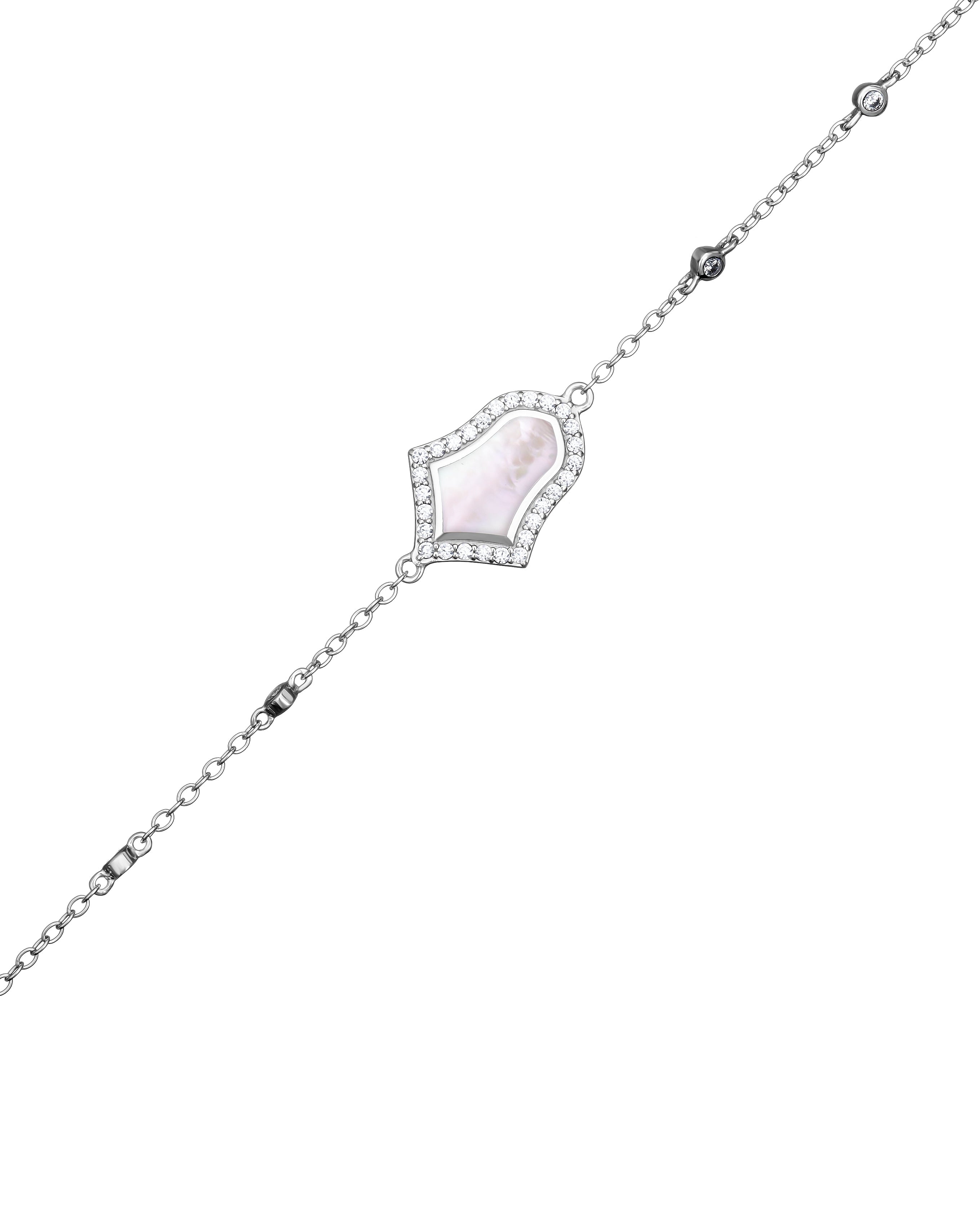 Delicate silver bracelet with a central gemstone on a white background